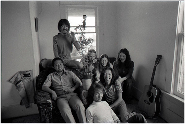 From left: unidentified, Yoshi, Kenneth Fletcher, Annastacia McDonald, Charles Rea, Paul Wong, unidentified, with pot plant and Mr. Fischer, 4196 Main Street, c. 1976, Courtesy of Kazumi Tanaka