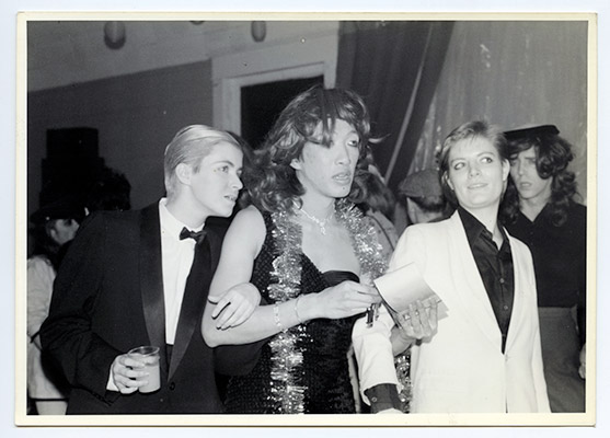 Paul Wong and escorts at the fifth annual Drag Ball held at the NDP Hall, 4603 ½ Main Street, December 19, 1980, Courtesy of Mary Janeway